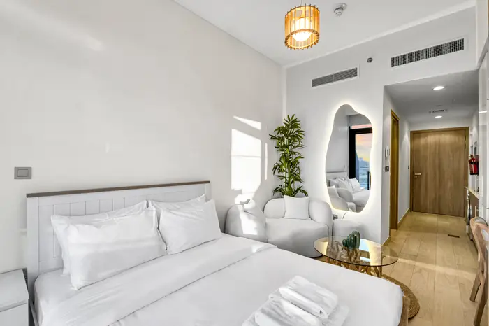 Bed with backlit mirror styling