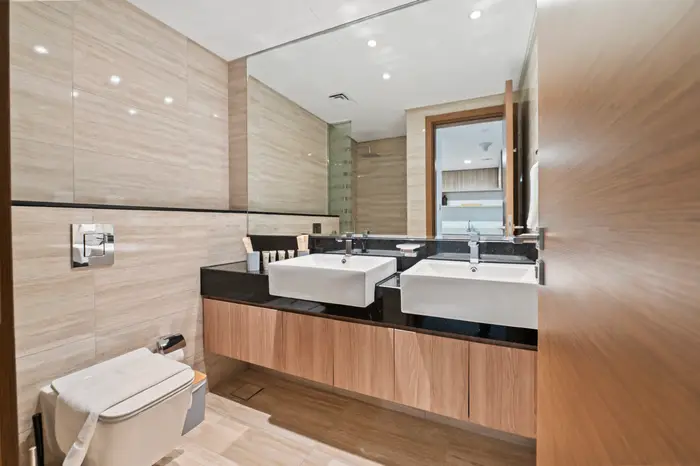 Stone bathroom with twin vanities
